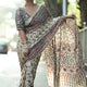 Ivory Modal Silk Ajrakh Printed Saree with Traditional Floral Motifs, Heritage Border & Tassel Detailing